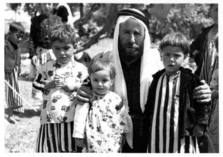 Qewal Hasan and his children in Bahzan, Iraq, 1957