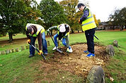 Lloyds Managers repairing the Sleeping Dragon (Children's Pay Mound)