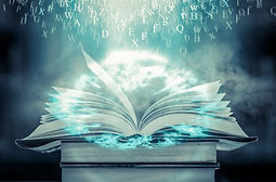 Open book on the table and English alpha