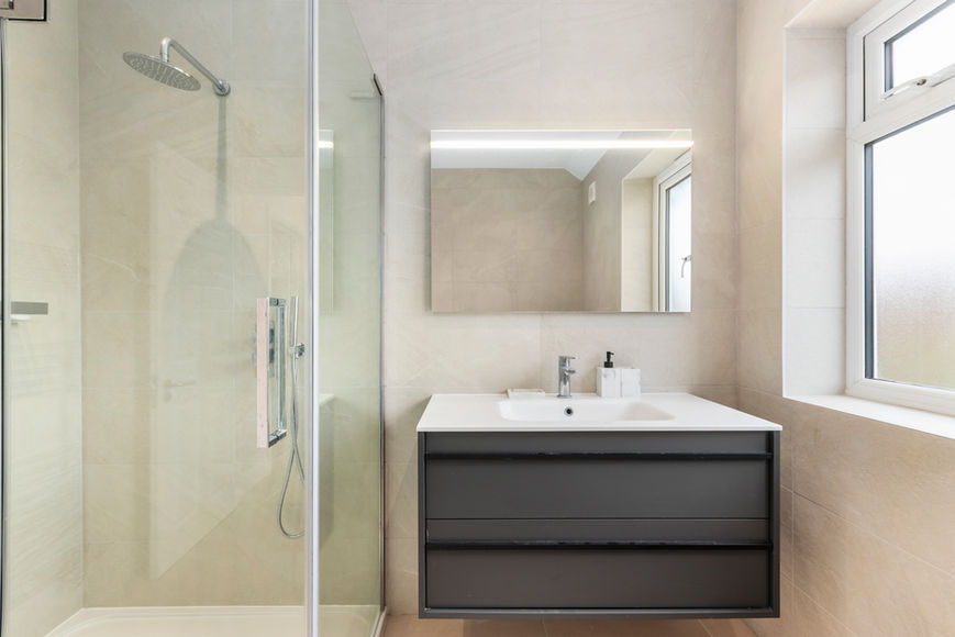 Bathroom with shower and sink