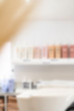 A picture of hair products on a shelf in-store