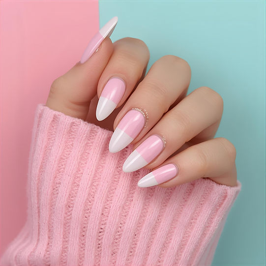 hand with pink and white acrylic nails with a green and pink background