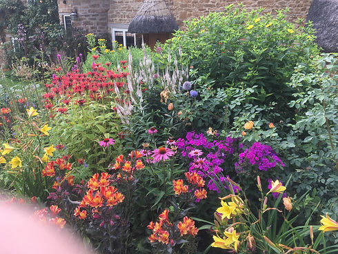 gingerbread cottage. Perrenial border. Design. EGDM Cotswolds. Quentin Delbrooke- Jones. Esher Garden Design and Maintenance