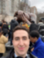 WGBH wintern selfie in front of The Embrace statue