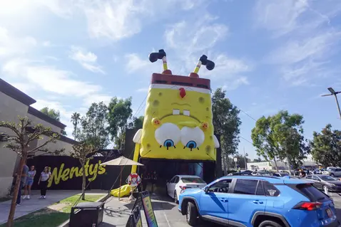 Custom inflatable SpongeBob SquarePants displayed outside a Wendy's restaurant for a promotional event.
