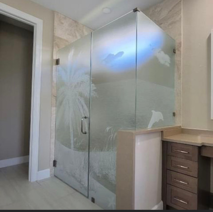 Tropical Custom Decorative film design for shower enclosure. hand selected elements by the customer includes: Palm tree, seagrass and dolphin. Good privacy level.