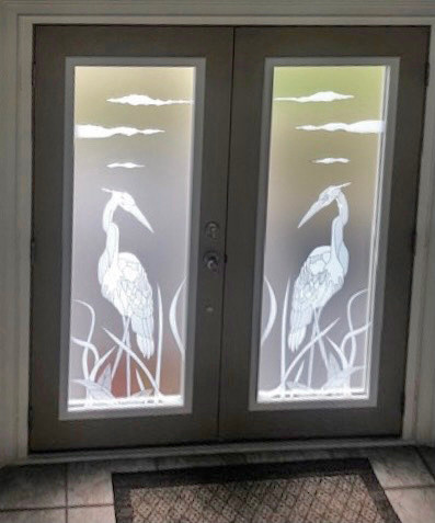 double heron looking at each other. mirrored, white frost on matte frost. bold, smarter than etching.