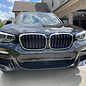 Front end of BMW SUV that is freshly detailed