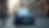 Eye-level view of a blue Ford Fiesta parked on a city street