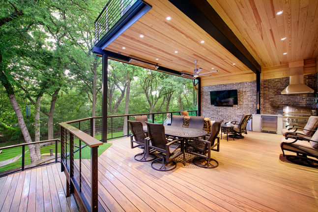 Professional custom deck build with integrated iron safety railings in Lewisville.