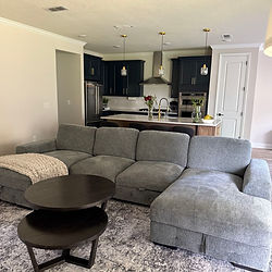 Clean living room and kitchen showing maintenance cleaning.