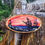 Thumbnail: Miniature Wood Slice Landscape Painting | Sunset Over Rocky Shoreline