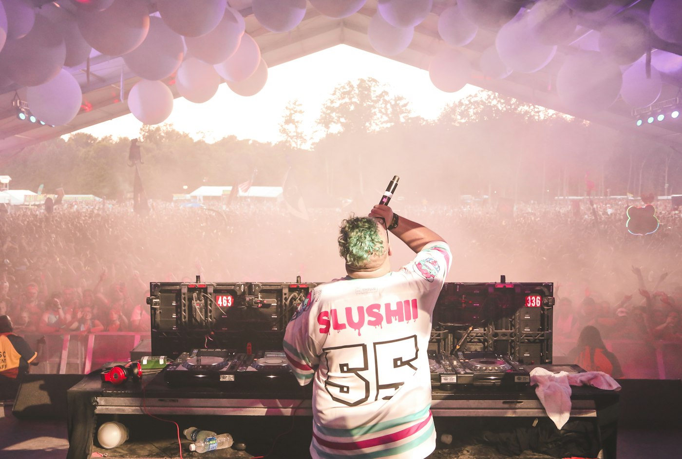 Real editorial photograph of dj and festival audience. Cover for Making a DJ Set Feel Like a Journey