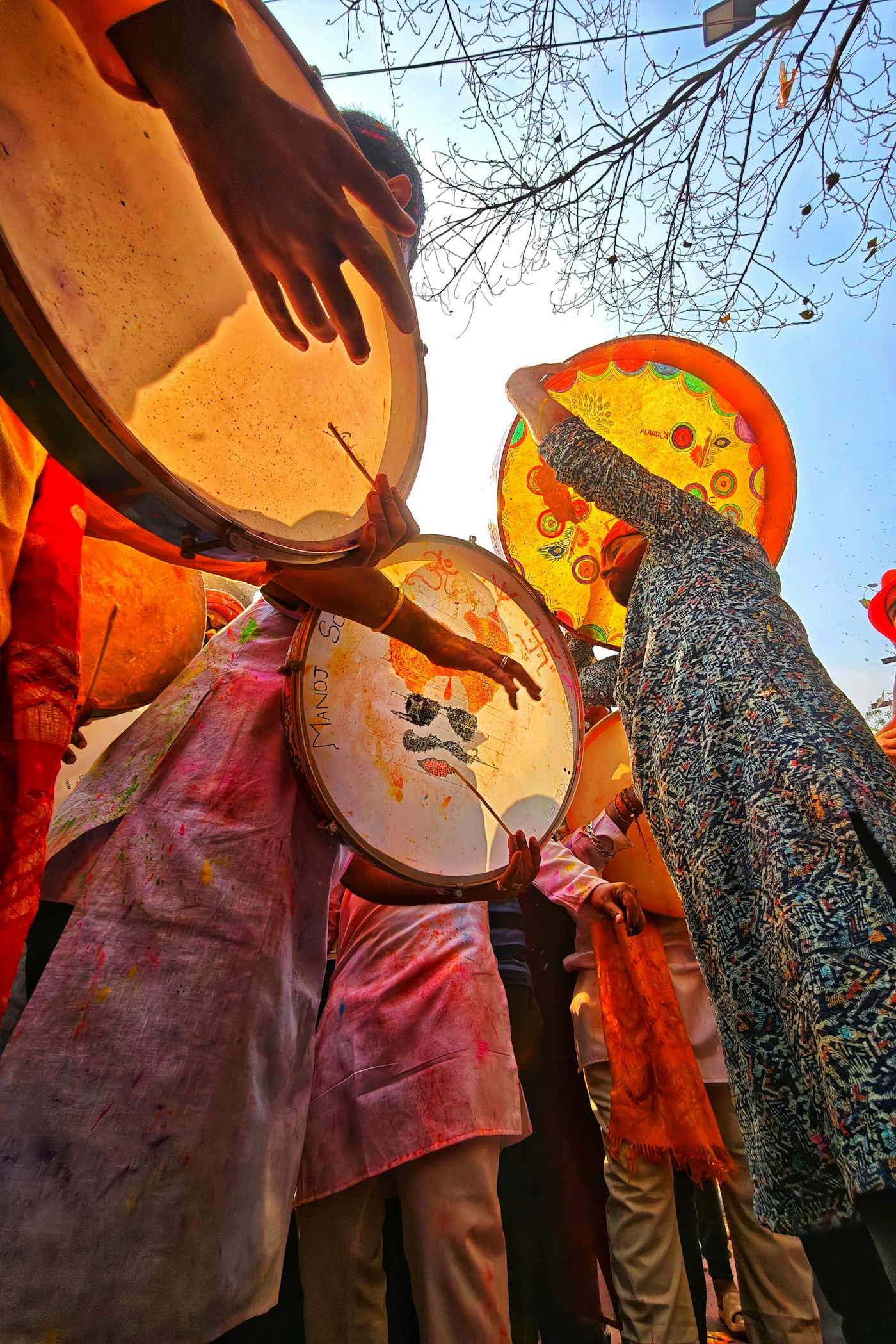 Real editorial photograph of people with drums at festival. Cover for Rhythm and Trance: What Drumming Can and Cannot Do to the Mind