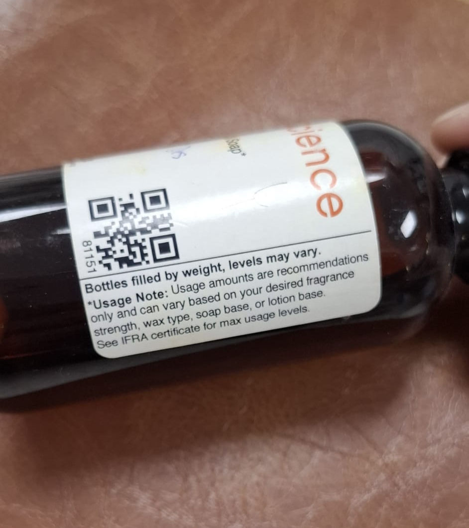 Close-up of a CandleScience fragrance oil bottle label showing usage notes and reference to the IFRA certificate for maximum usage levels.