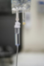 Close-up of an IV drip providing hydration and nutrients.