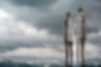 Tragic Love: Moving metal figures Ali and Nino at Batumi's Black Sea shore. Background: the Caucasus mountains.