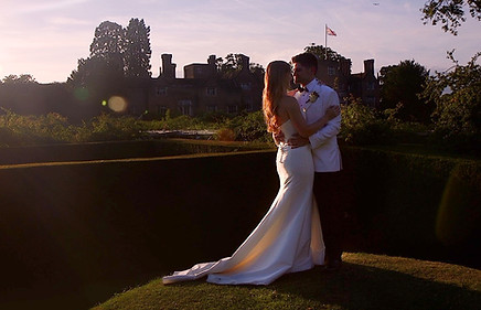 bride and groom kissing in a sunset during their wedding in Surrey taken by a videographer