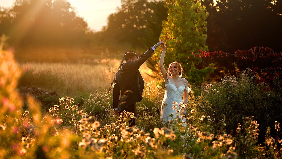 Bride and groom embracing in golden evening light during natural wedding portraits