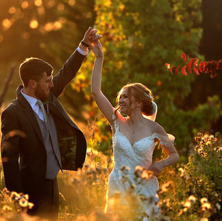 Bride and groom enjoying natural wedding day moments outdoors