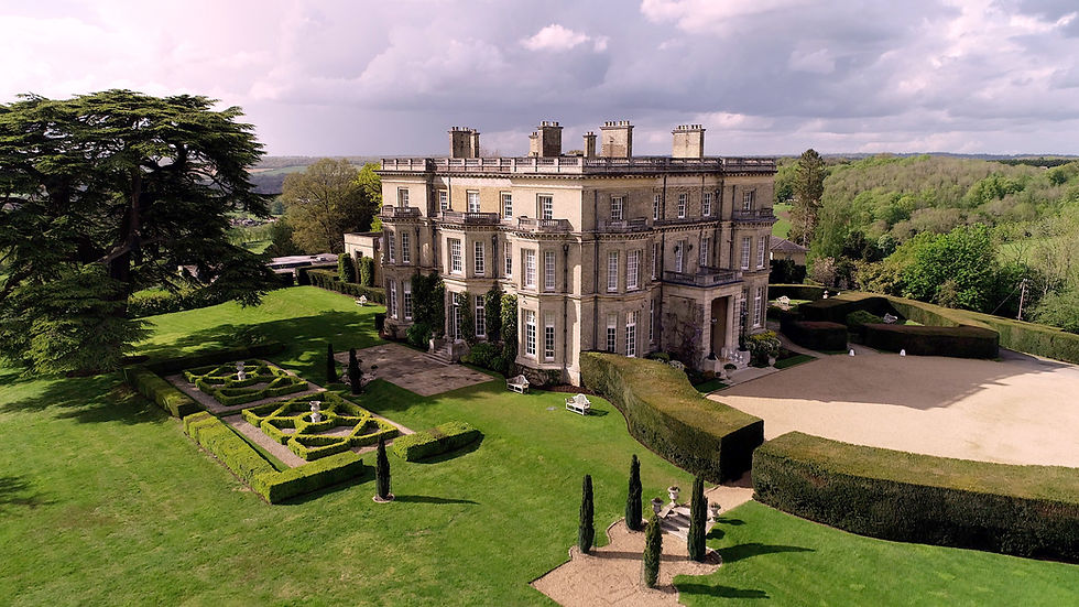 A drone shot of Hedsor House wedding venue and the surrounding gardens and landscape.