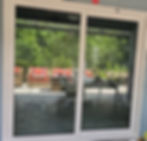 Residential remodeling of white sliding glass patio doors.