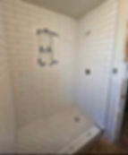 Residential and commercial remodeling of a tiled shower.