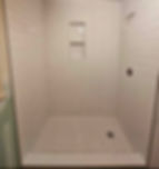 Modern residential and commercial remodeling of a tiled shower.
