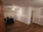 Residential remodeling of a room with new drywall and flooring
