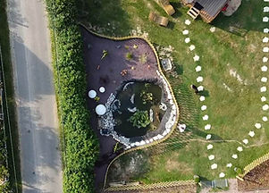 A bird's-eye view of the bay and the mini-thatched cottages in Normandy, a nature-filled and friendly family holiday