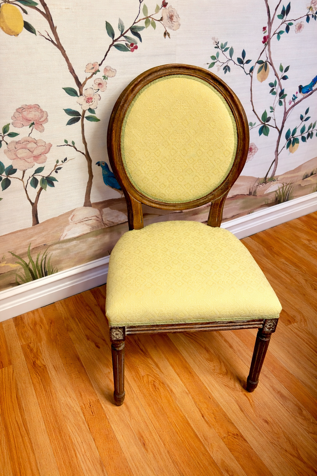 Custom upholstered chair featuring pale yellow fabric selected by an Annapolis customer for an upholstery project