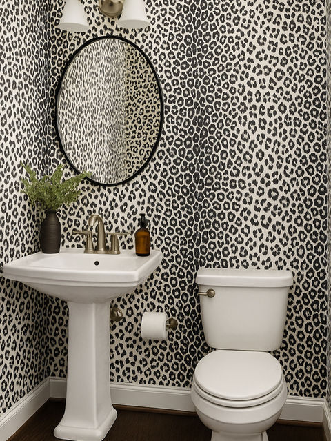 Custom leopard print wallpaper installed by Mill End Shops in a modern powder room
