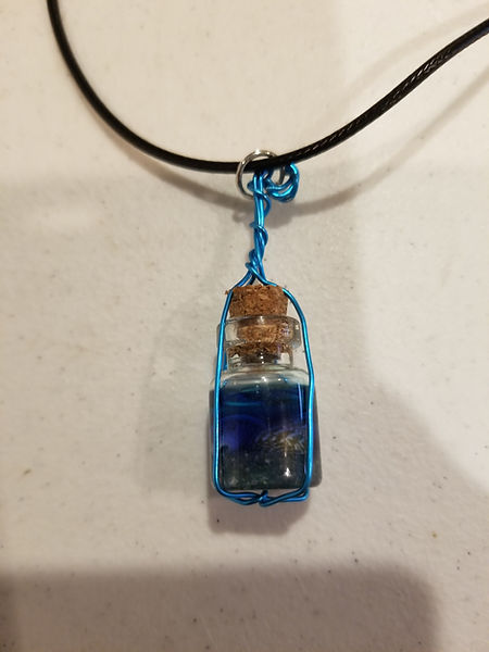 Beach in a Bottle Necklace | 1" beach in a bottle with cork w/ silver or blue wire wrapping on 18" wax cord | resin | reinart | resincraft | resin artist | resin crafter | resin jewelry | beach in a bottle | beach jewelry
