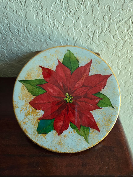 Poinsettia hot pad | 8" round cork hot pad painted in white and gold with a poinsettia napkin decoupaged and sealed with resin | poinsettia flowers | poinsettia decor | acrylic art | decoupage | decoupage art | resin | resin craft