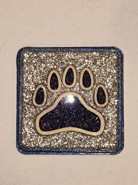 Bear Paw | 2.5" coaster with a onxy bear paw against a silver background | resin | resin art | resin crafts | bear paw | bear | coasters | beardecorations