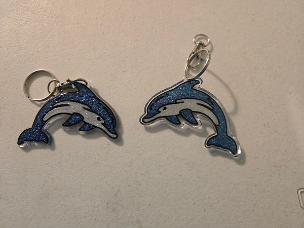 Guardian Dolphins? | 2.5" dolphin keychains in blue and white glitter varnish finished with UV resin | resin | UV resin | dolphins | dolphin love | glitter varnish | keychains | keychains for sale