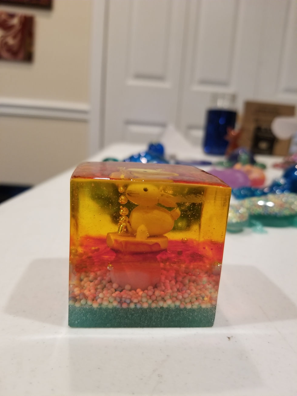 Bunny | 3" resin cube with a bunny with green, pink and yellow layered resin | resin | resin art | resin artist | resin artwork | resincrafter | resincraft