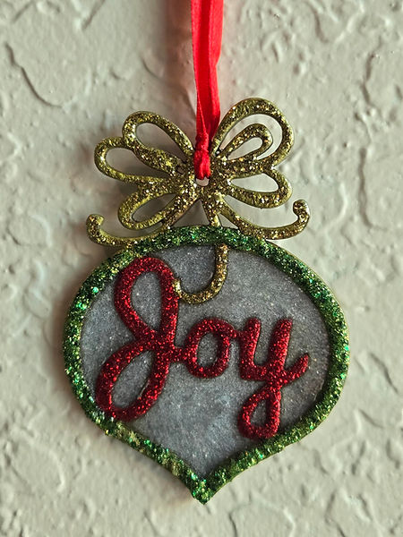 Joy| 2.5 " wood ornament with Joy lettering in red, bow in gold and perimeter in greens with resin in silver and silver glitter back finished with red ribbon | resin | resin crafter | resin craft | resin artwork | Christmas Decor | joy Decor