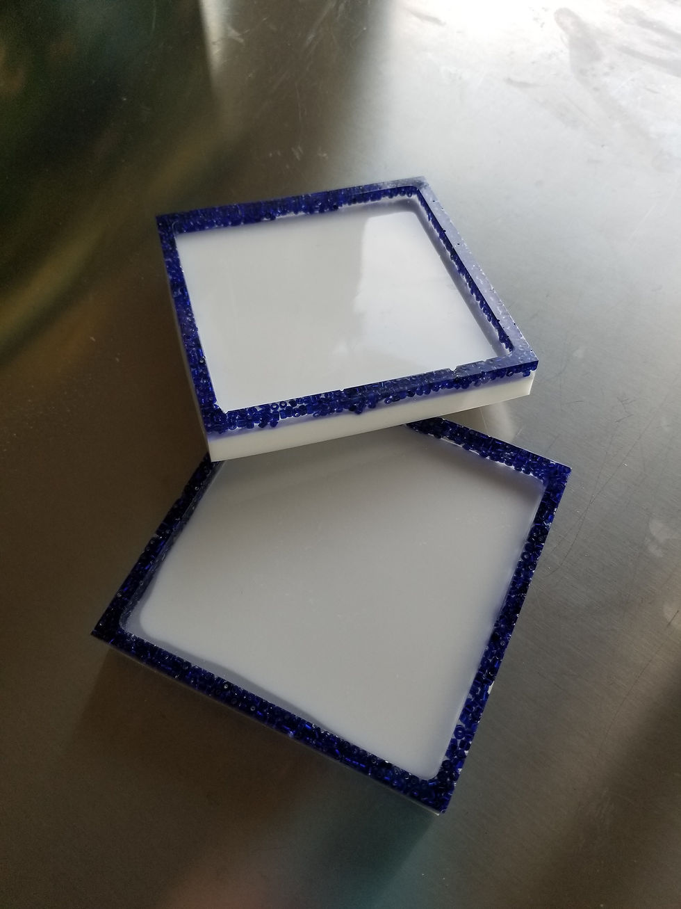 Milk Glass and Beads | resin coasters in milk glass white and sapphire blue bead boarder |functionalart |functionalartwork |resinart |resinartwork |resin |resinpour