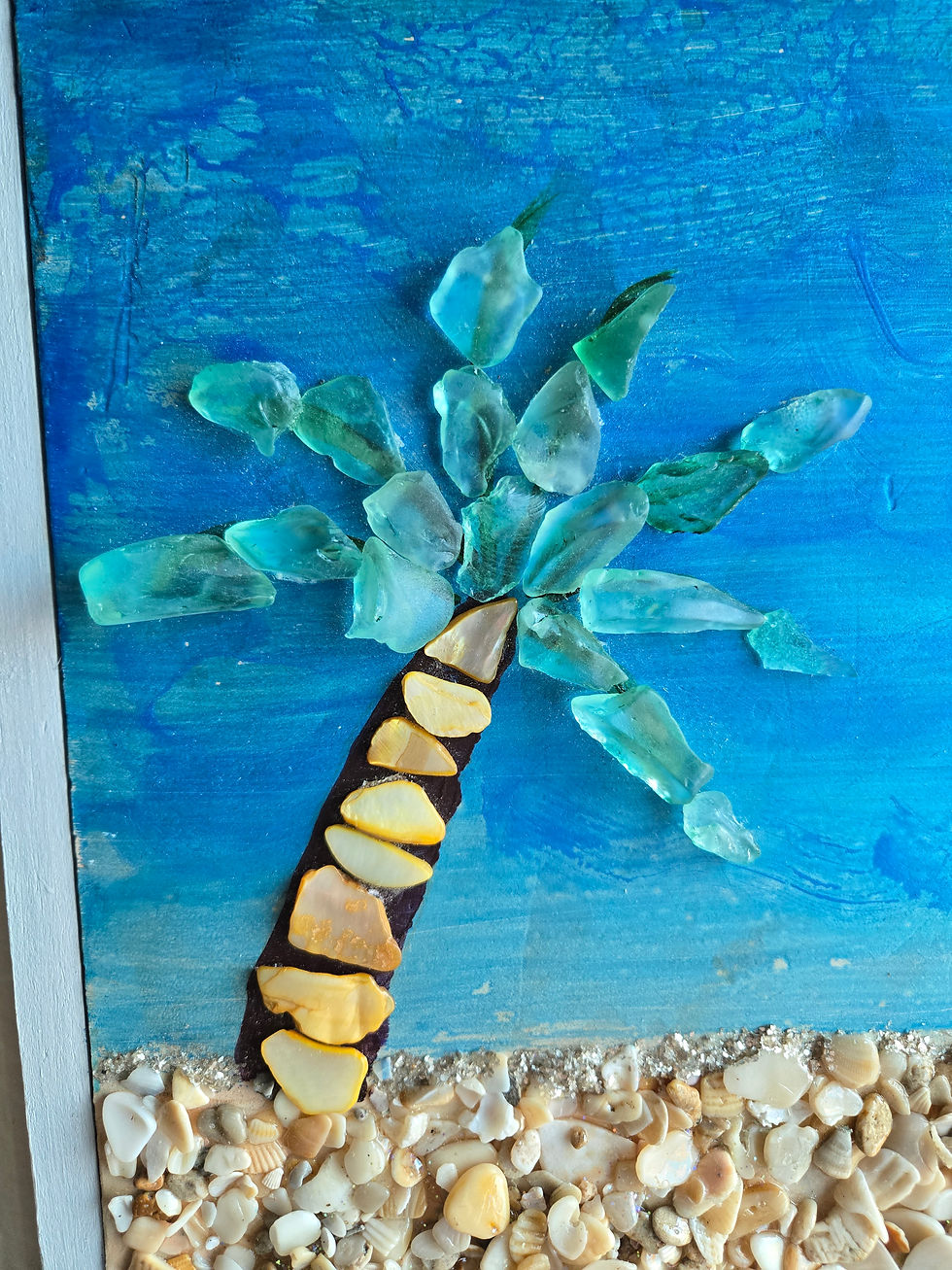Shell Beach - 12x12 masonite board painted into a beach scene with seashells for the beach, abalone shell to embellish the palm tree which has sea glass as fronds and five turtles entering the sea made with glass beads | 3dart | acrylic painting | mixed media | sea glass art | seashell art | turtles | turtlelovers