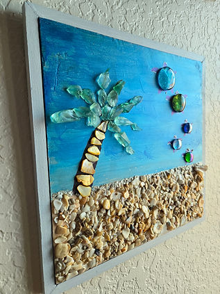 Shell Beach - 12x12 masonite board painted into a beach scene with seashells for the beach, abalone shell to embellish the palm tree which has sea glass as fronds and five turtles entering the sea made with glass beads | 3dart | acrylic painting | mixed media | sea glass art | seashell art | turtles | turtlelovers