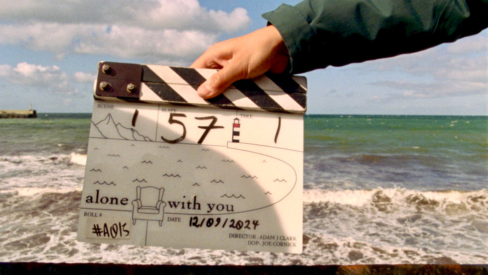alone  with you clapperboard framed by the sea.