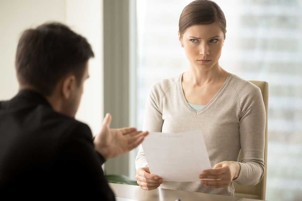 Millennial businesswoman with skeptical facial expression holding contract document and li