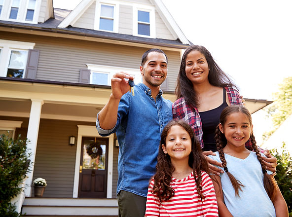 bigstock-Portrait-Of-Family-Holding-Key-222446638