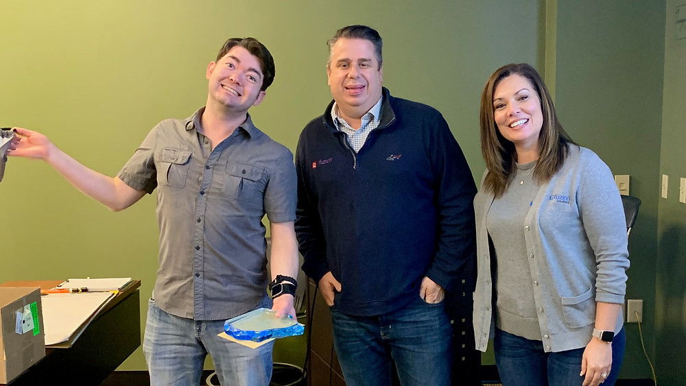 Jon McKinnon was given an award by Infuzion Solutions owners Corrie and Toby Olson for working at Infuzion Solutions for 10 years.