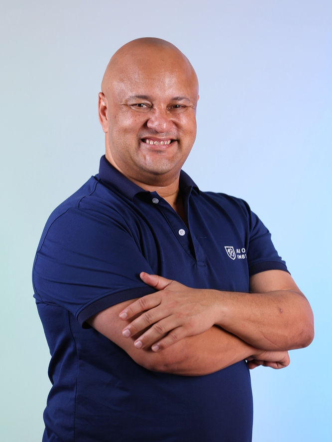 Portrait of Dave Hajdu smiling confidently with arms crossed.
