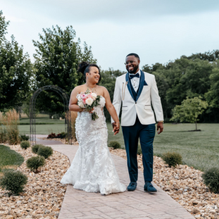 Bride and groom walking together.
