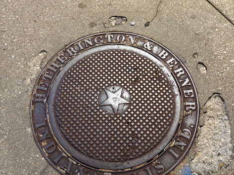 historic manhole cover with the name Hetherington and Berner