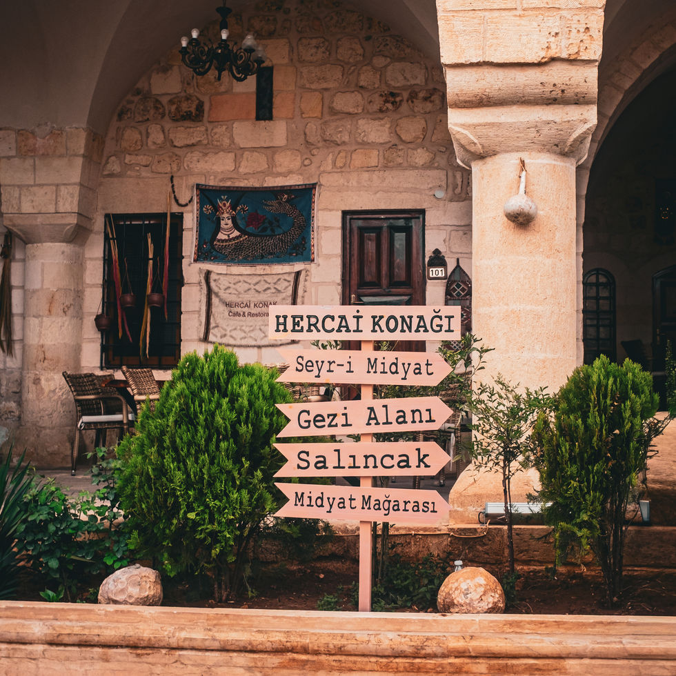 A traditional Syriac mansion built of yellow stone in Midyat, with stone carvings and arched windows