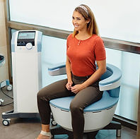 Woman sitting on a chair that help with pelvic floor strength